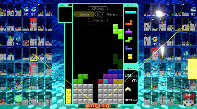 Na foto animada, mostra tetris 99, o tetris online com 100 jogadores simultâneos.