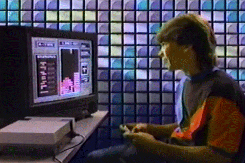 35 anos de tetris: um clássico inesquecível em nossos corações Foto animada mostra um menino feliz ao realizar pontos enquanto joga tetris.