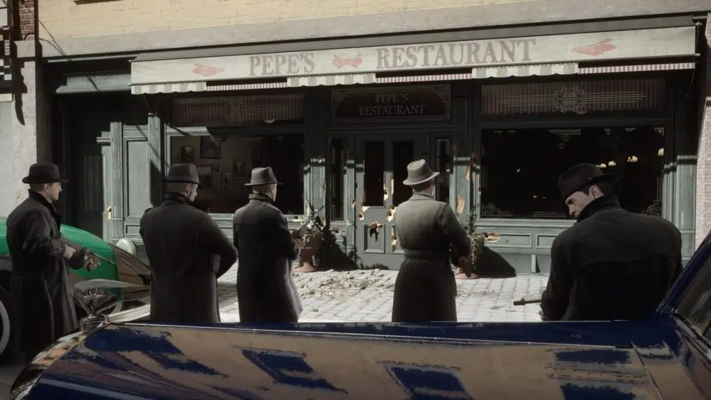 Review: mafia: definitive edition, nova roupagem para um jogo antigo Mafiosos abrem fogo contra um estabelecimento.