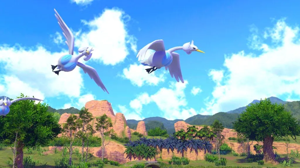 Review: new pokémon snap, a foto mais bela da franquia A cena mostra dois pokémon voando em uma floresta com montanhas ao fundo