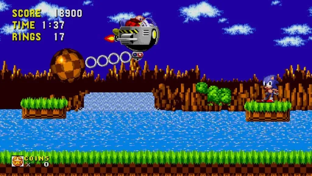 Review: Sonic Origins is een nostalgisch bitterzoete ervaring Screenshot van een clash tegen Robotnik, waarbij Sonic op het platform staat en de speler boos aankijkt.