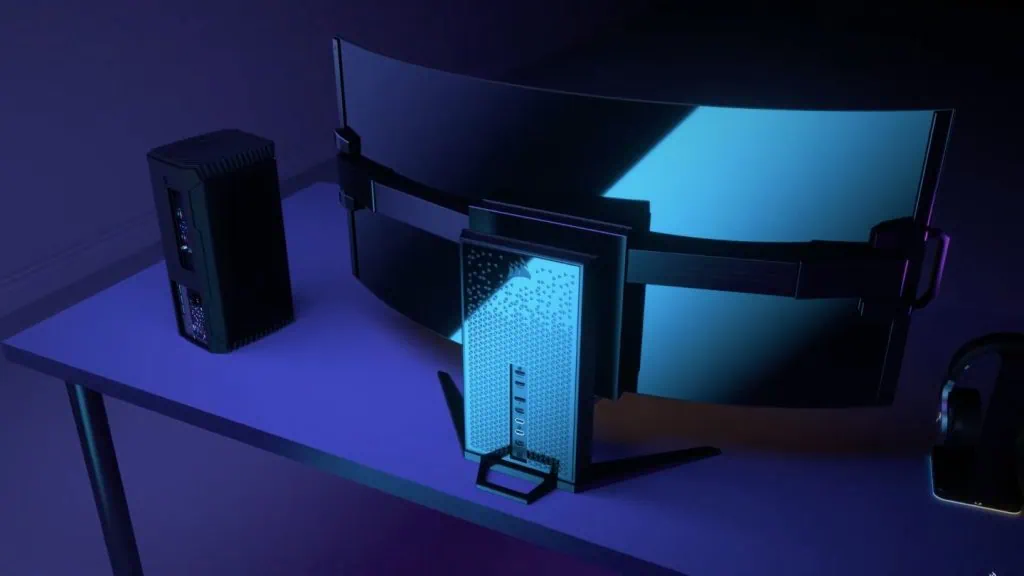 Corsair משיקה צג גיימינג עם מסך OLED גמיש גב צג המשחקים החדש והגמיש של Corsair, שנמצא על גבי שולחן, ולצדו רמקול ואוזניות