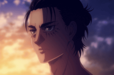 Eren yeager, protagonista do anime "attack on titan" em cena da última temporada. O personagem aparece com o cabelo preso e olhos azuis.