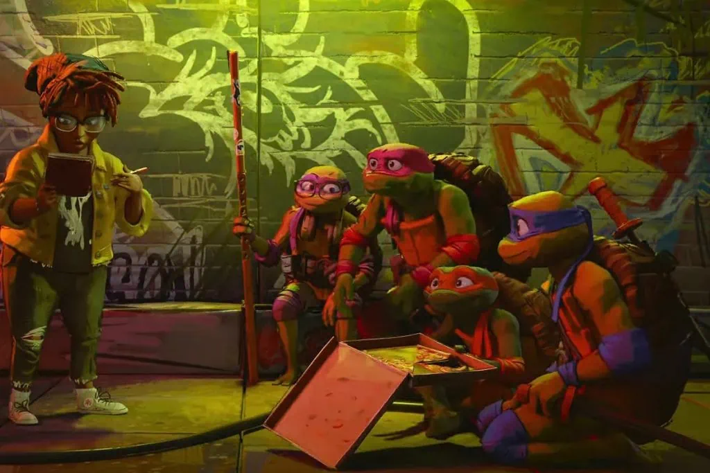 Cowabunga! Filme das tartarugas ninja é anunciado com trailer; confira As tartarugas ninjas: caos mutante ganha nova cena com as 3 tartarugas observando mulher falando e comendo pizza.