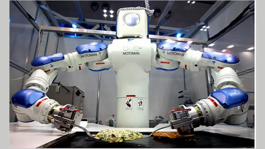 Robô motoman da yaskawa preparando comida