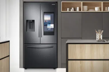 Smart refrigerator with water dispenser and black glass surface.