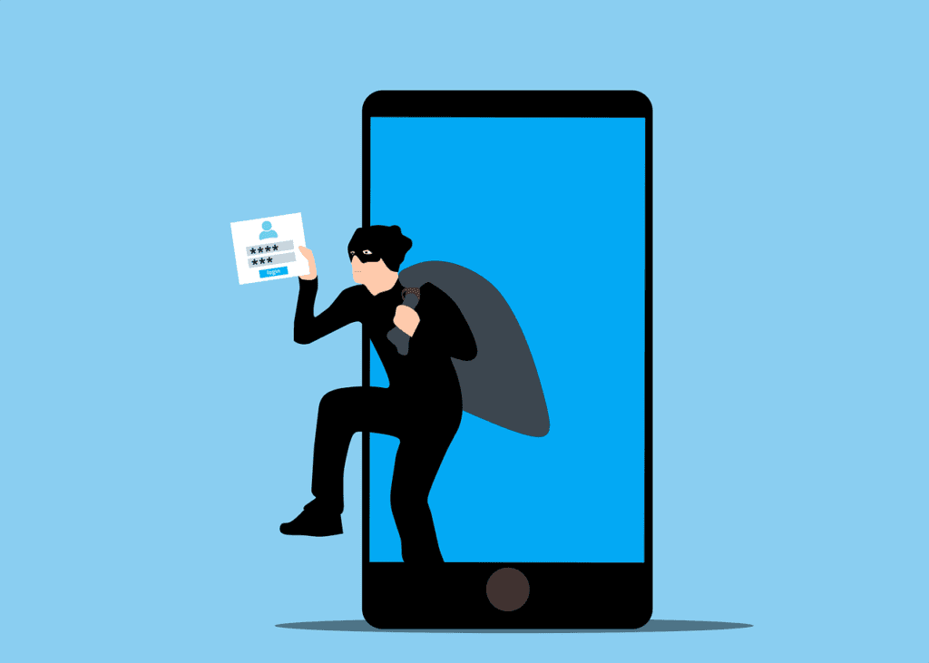 Roubo de identidade digital, hacker com máscara preta e capuz, invadindo smartphone com senha.
