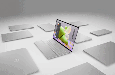 Laptop dell com display futurista e laptops variados ao redor, destaque em tecnologia e inovação.