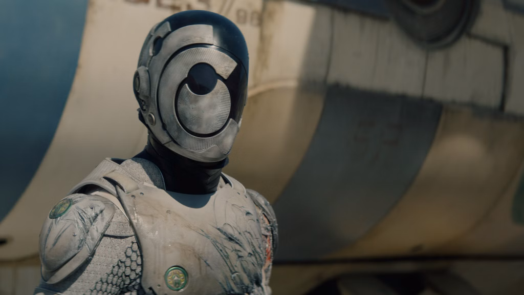 Personagem murderbot da série, um androide branco e preto em um cenário futurista