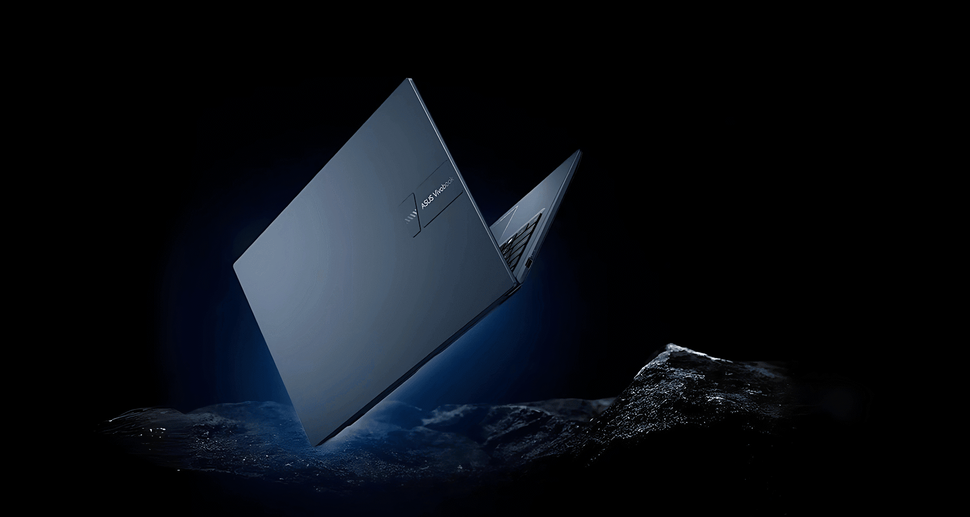 Asus Vivobook notebook emerging from the waters, highlighting technology and innovation.