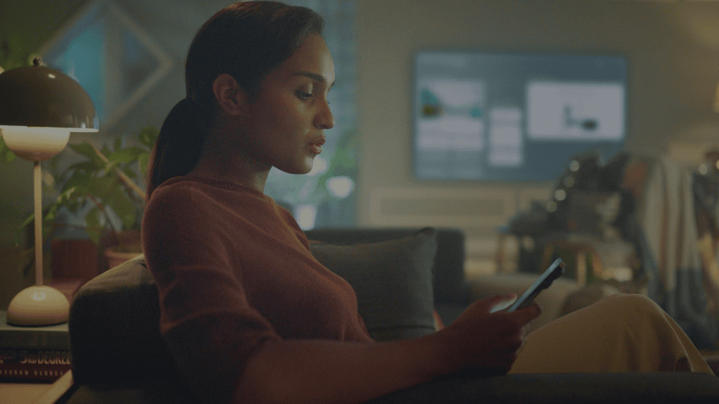 How LG ThinQ helps you have a connected home. Woman using LG ThinQ platform in connected home