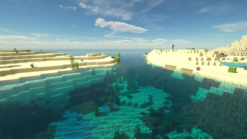 Praia virtual no minecraft com ambiente desértico e água cristalina.