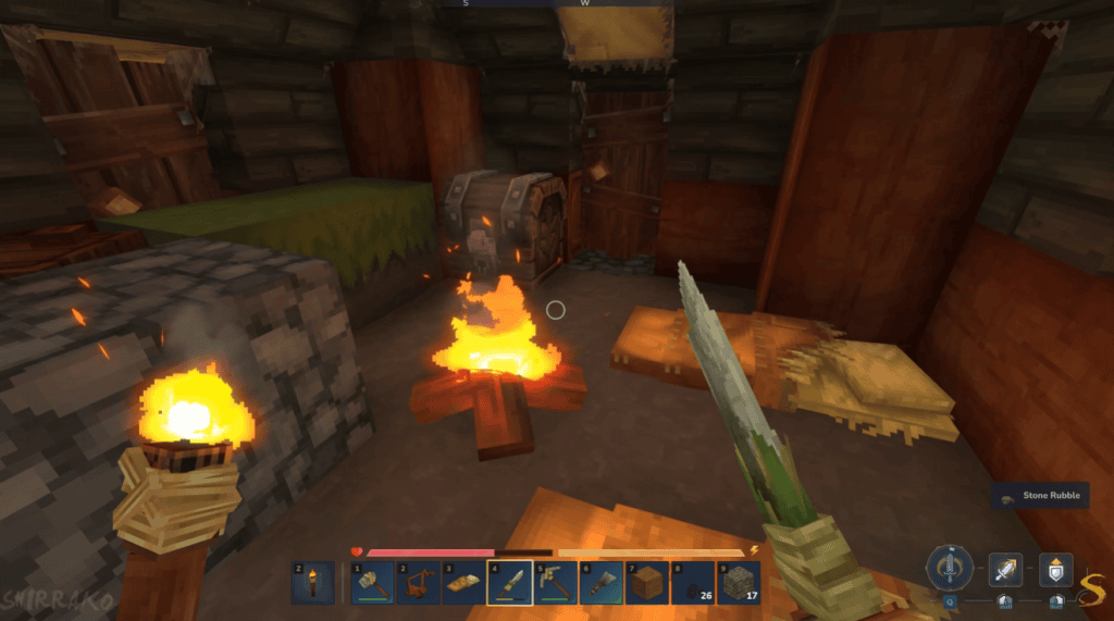 Jogo de sobrevivência minecraft ambiente rústico com fogo aceso, caixa de armazenamento e cama dentro de uma cabana.