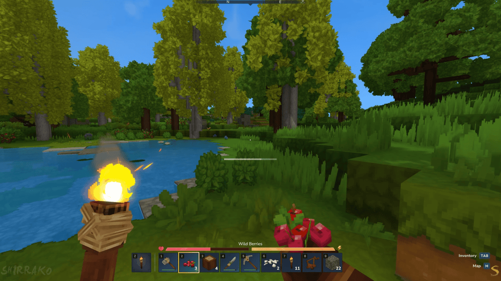 Fundo de jogo de sobrevivência com árvores, rio e fogo nesta imagem de gameplay do minecraft.