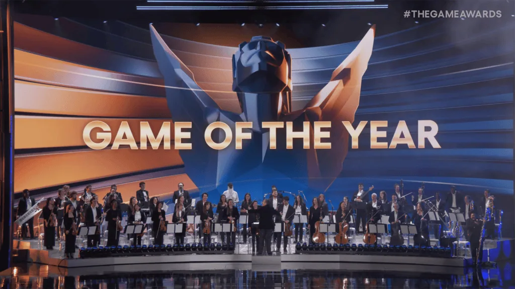 Calendário tech 2026: os principais eventos de tecnologia e inovação do ano Imagem de uma cerimônia com orquestra premiando o melhor jogo do ano no evento.