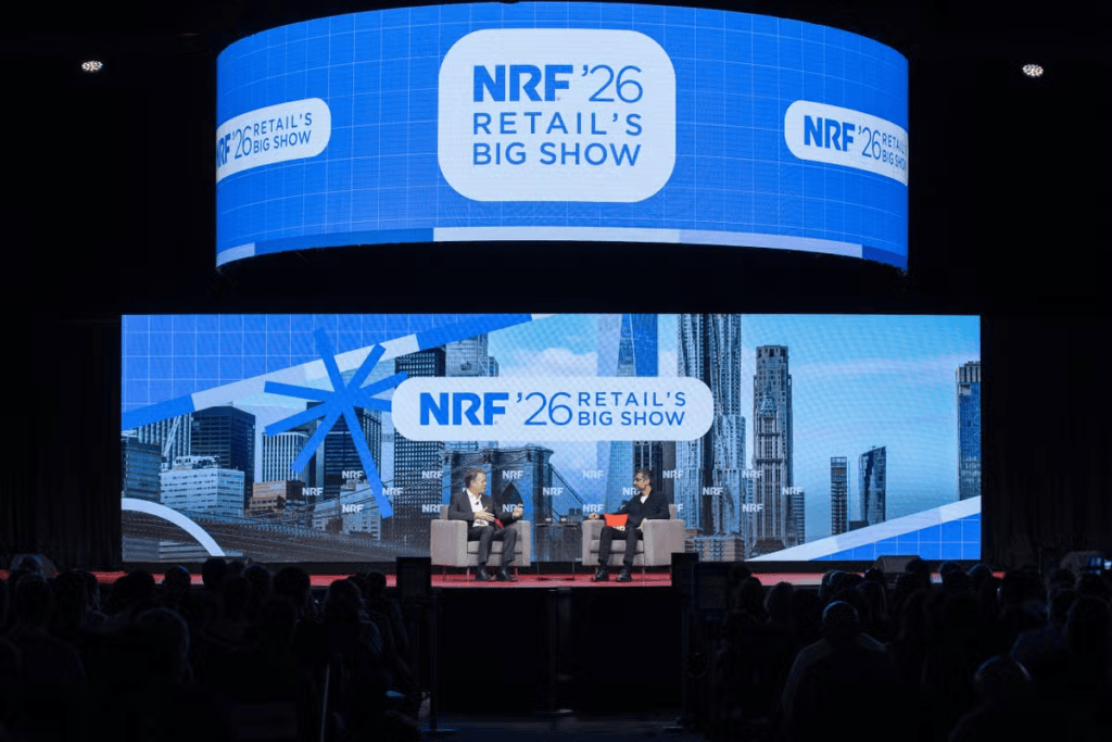 Calendário tech 2026: os principais eventos de tecnologia e inovação do ano Imagem de painel de conferência nrf 2026, destaque para inovação tecnológica no varejo.