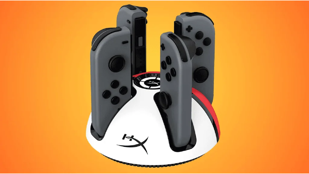 20 acessórios do nintendo switch 1 e 2 que você precisa conhecer! Controle joy-con nintendo switch cinza em suporte de carregamento.