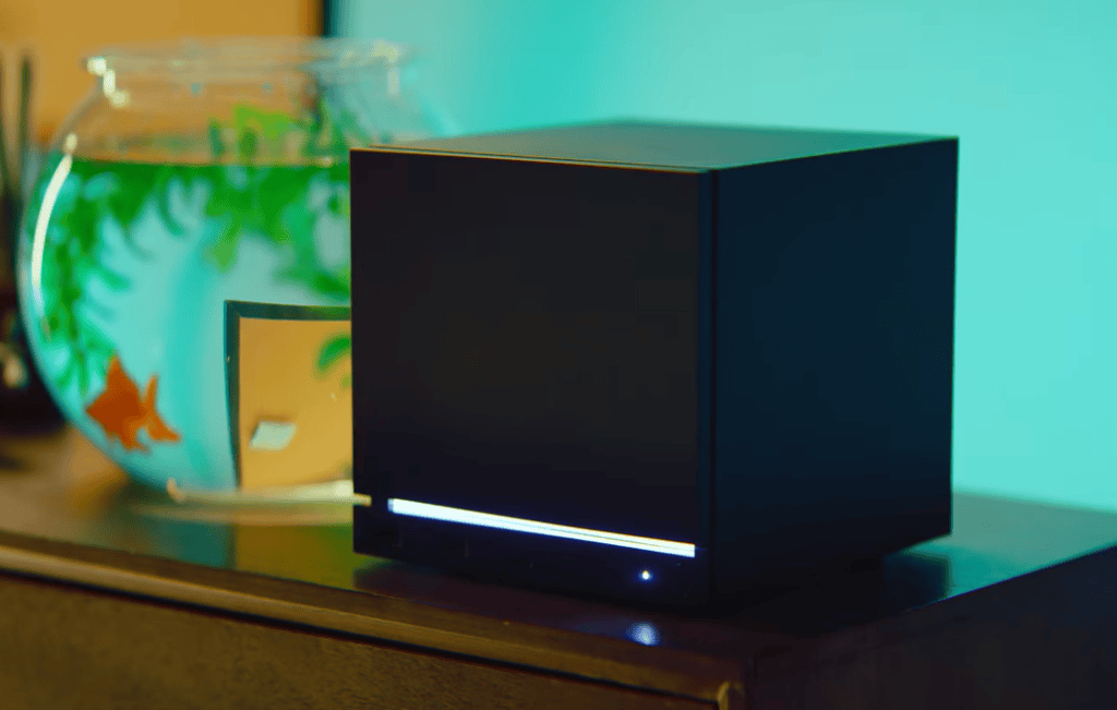 Steam machine da valve sobre superfície com iluminação ambiente, o mini pc para jogos no pc