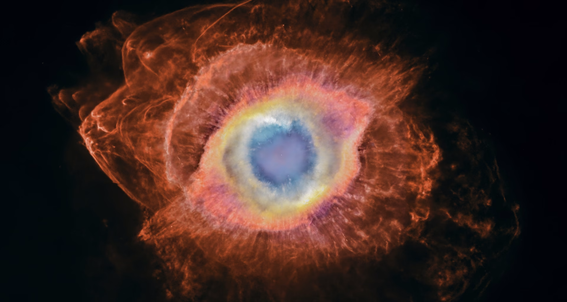 Nebulosa da hélice com choques em arco destacados ao redor do anel central.