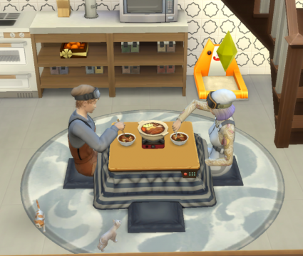 Review: the sims 4 diversão na neve é uma expansão espetacular ao game básico The sims 4 diversão na neve irmãos sim comem em mesa kotatsu junto a dois gatos